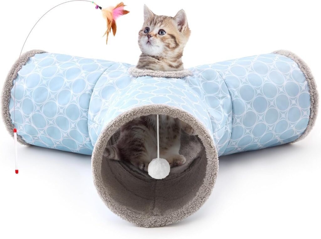 A ginger cat playing inside a colorful Tempcore pet tunnel on a wooden floor.